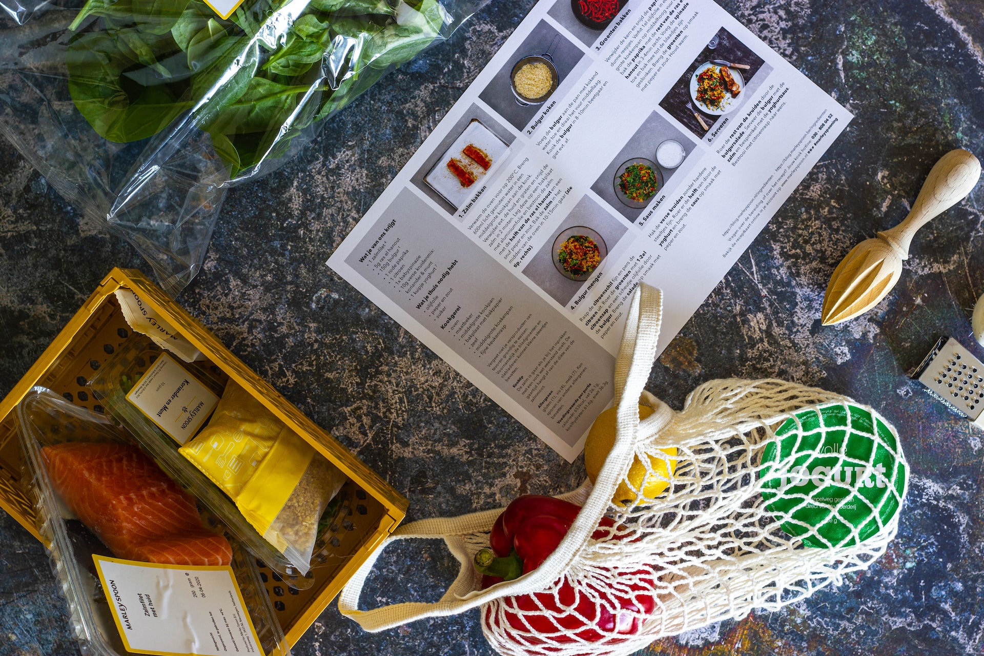 picture of recipe book and healthy foods on counter top